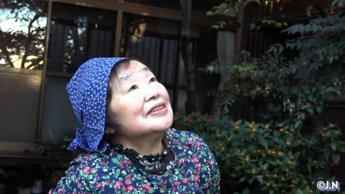 Image: Miwako looking at the zelkova tree (with copyright)